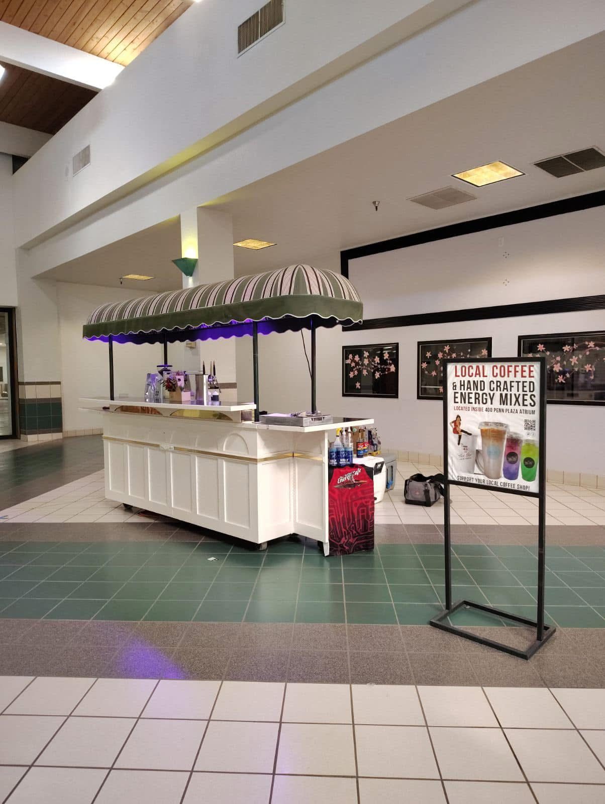 The Hot Bev outdoor cart set up indoors at the 400 Penn Plaza atrium