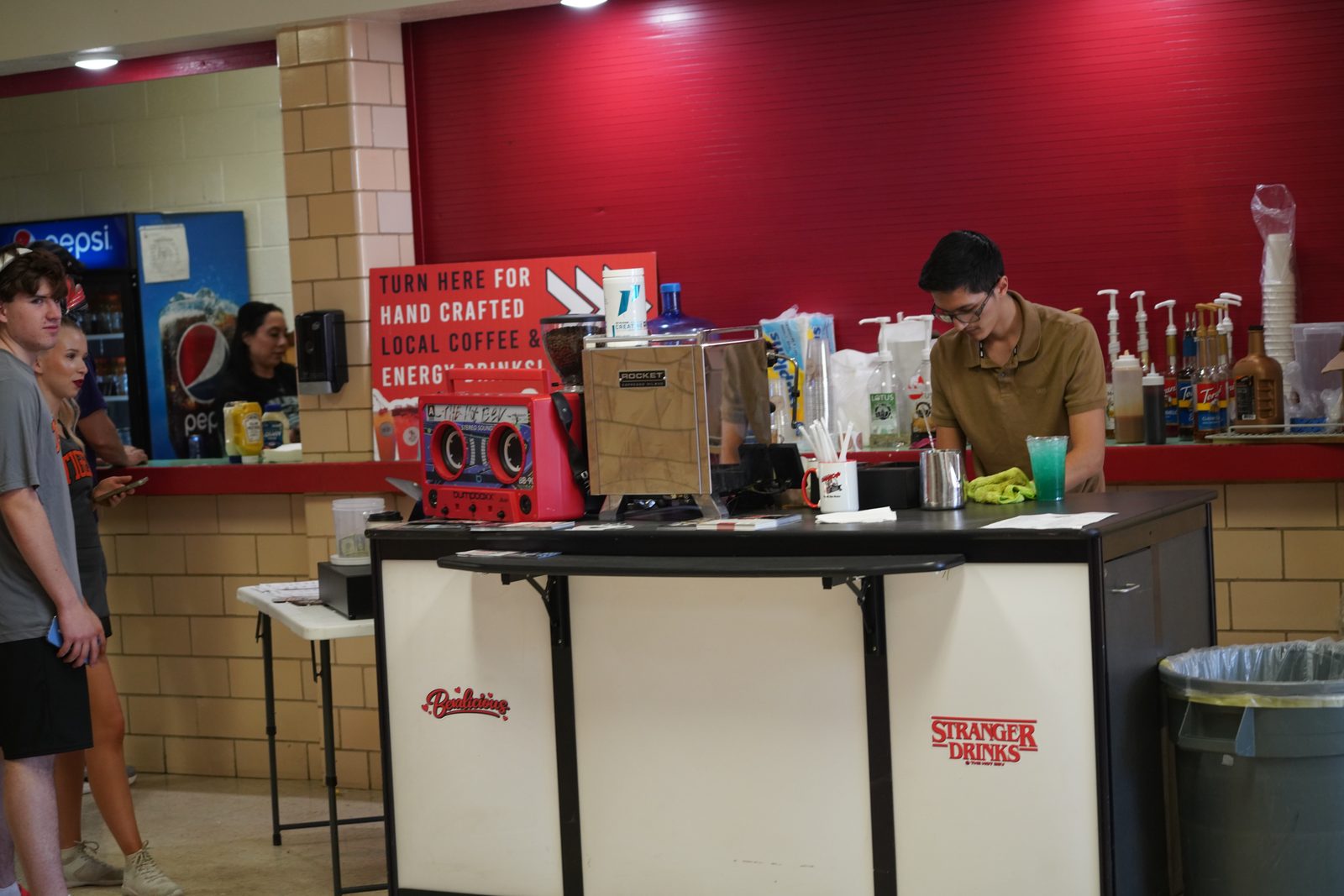 The Hot Bev compact espresso bar set up indoors at a Roswell High School cheer competition