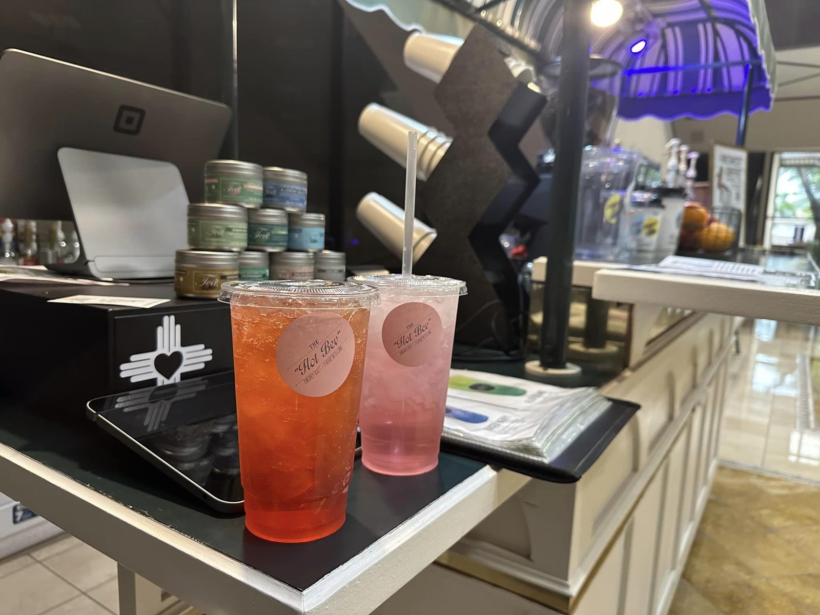 Two colorful iced Hot Bev refreshers on the cart counter